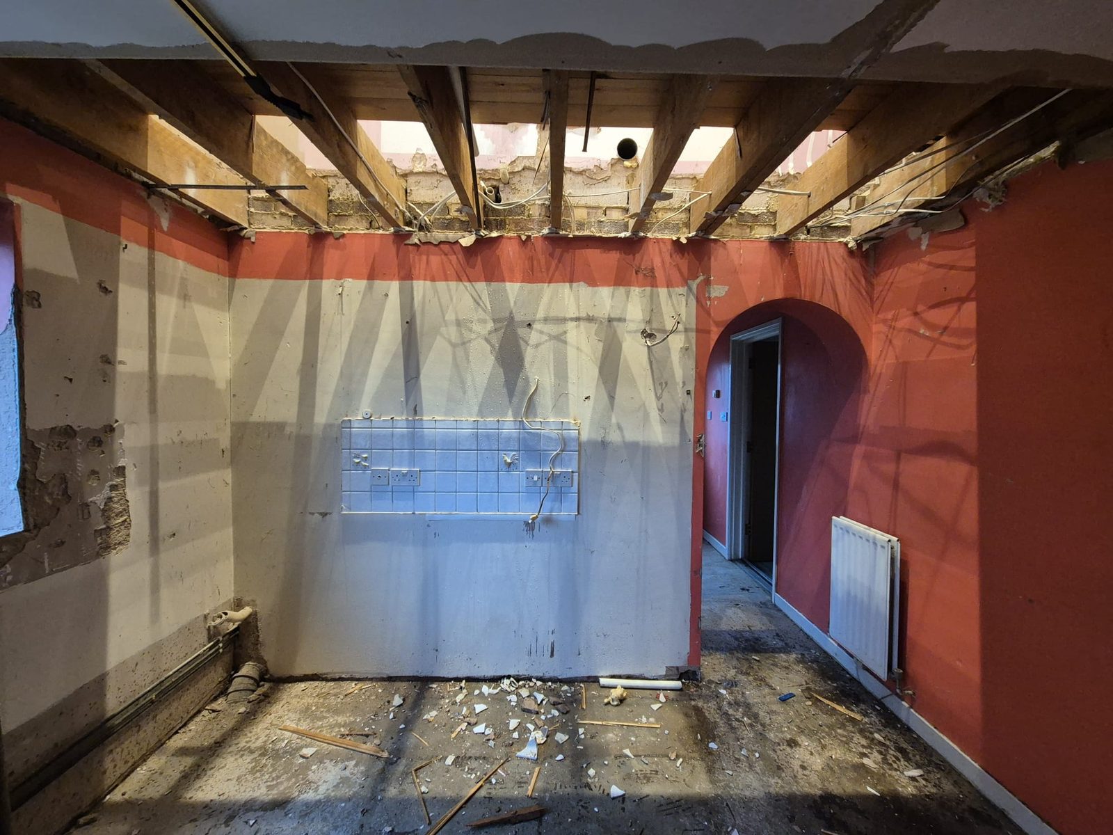Room stripped back with the ceiling opened up