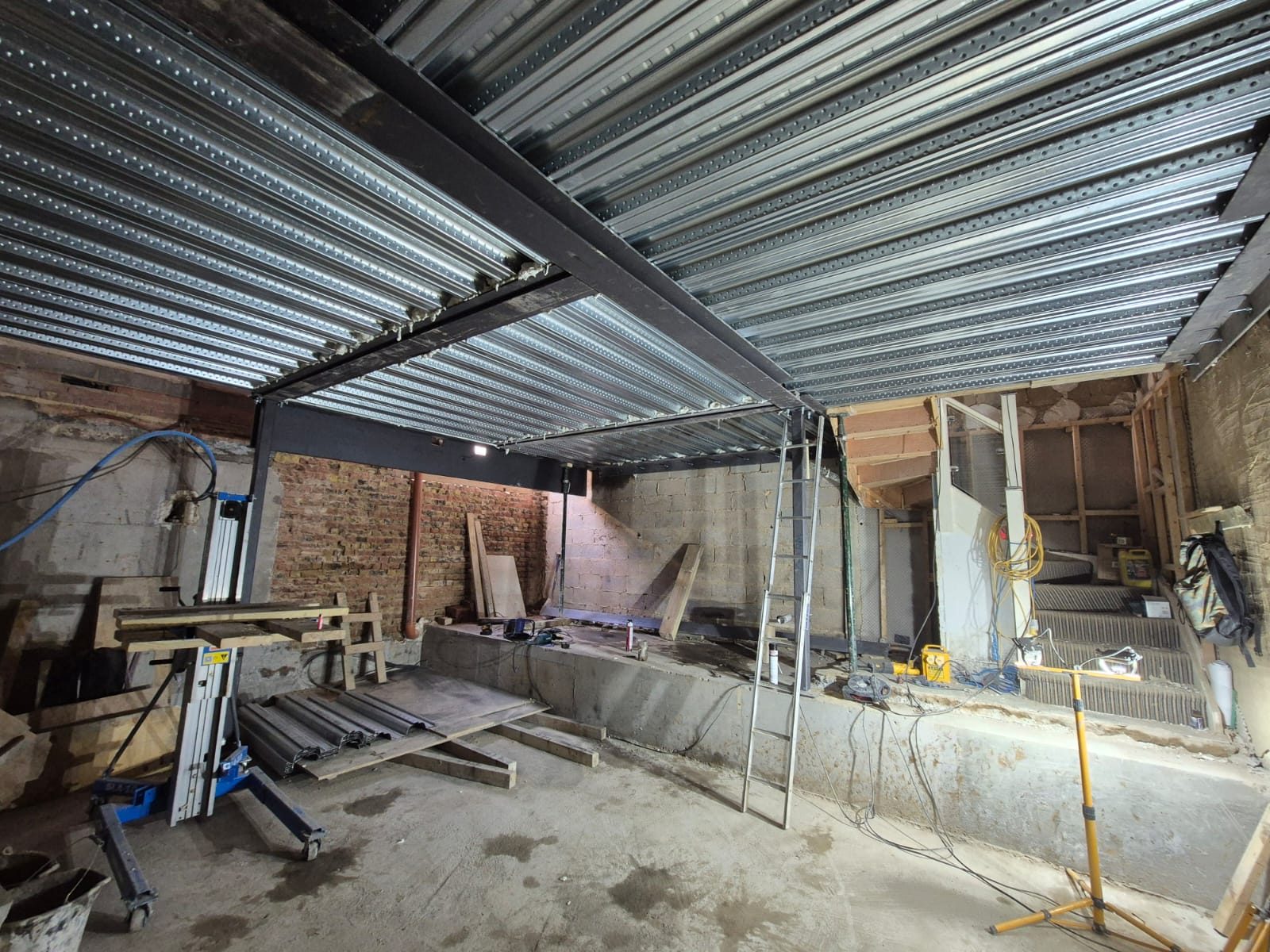 New steel frame and metal deck over the basement