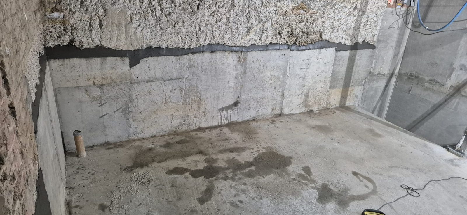 Underpinning along the basement wall