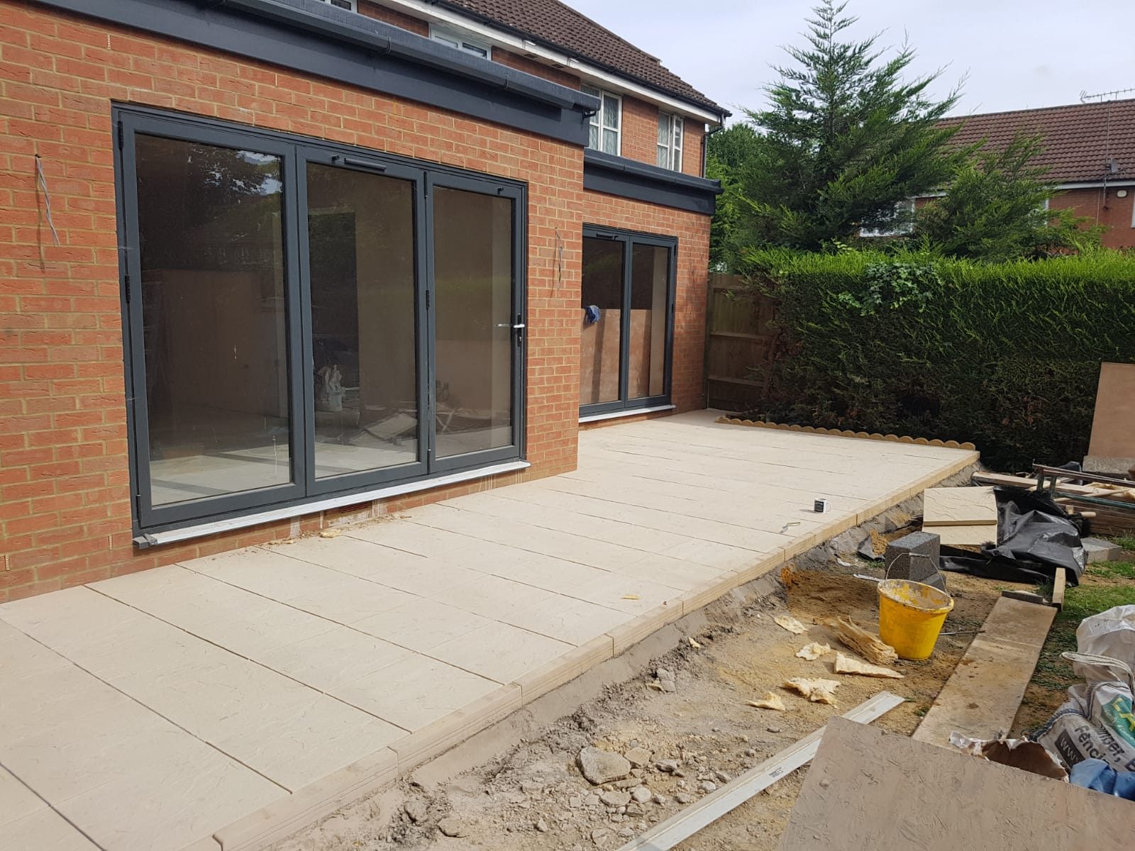 Brick extension with bifold doors and new paving