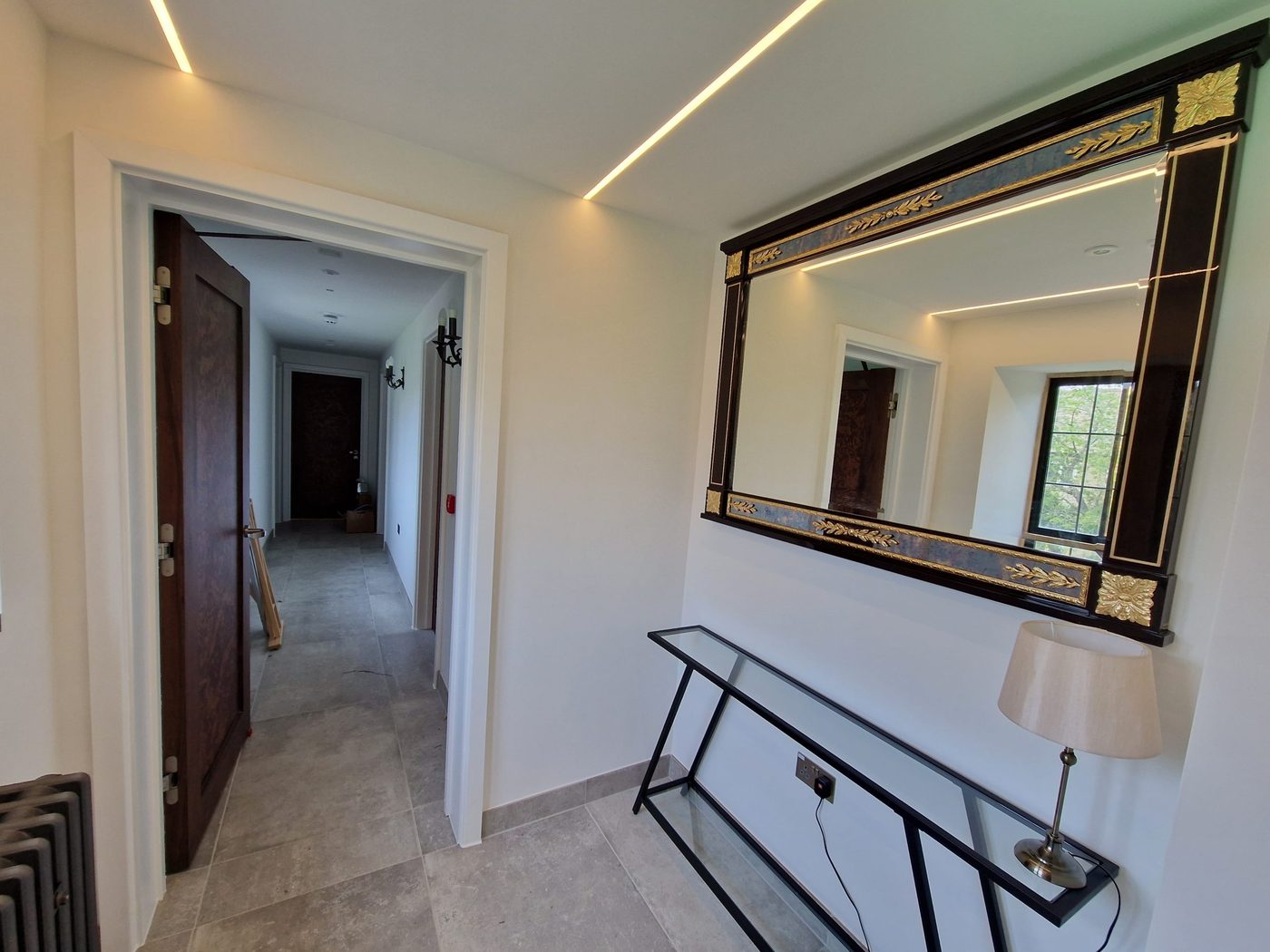 Refurbished hallway with a feature mirror