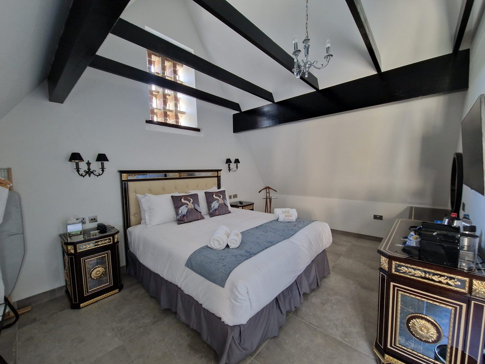 Hotel bedroom with exposed beams