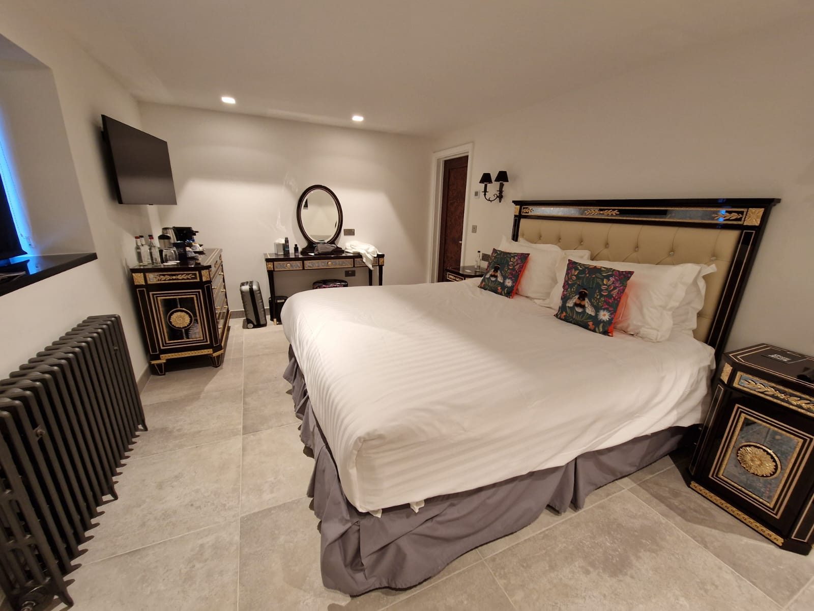 Hotel bedroom with dark furniture