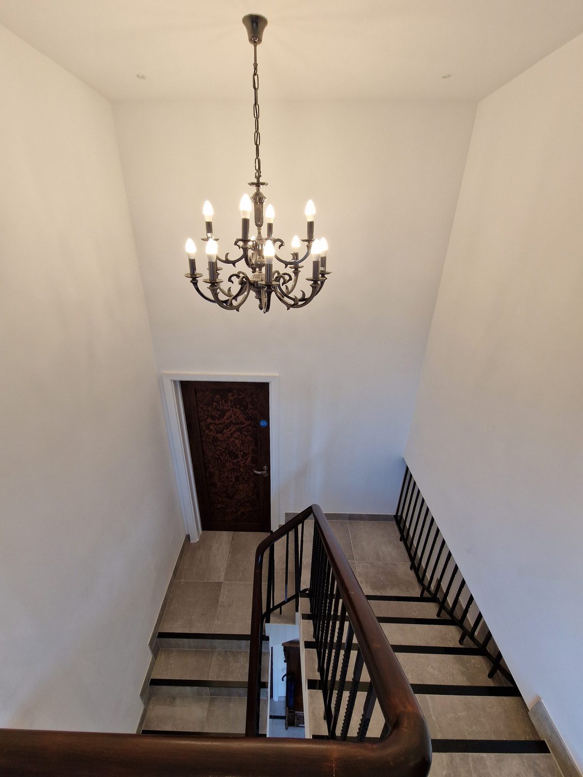 Staircase with a chandelier
